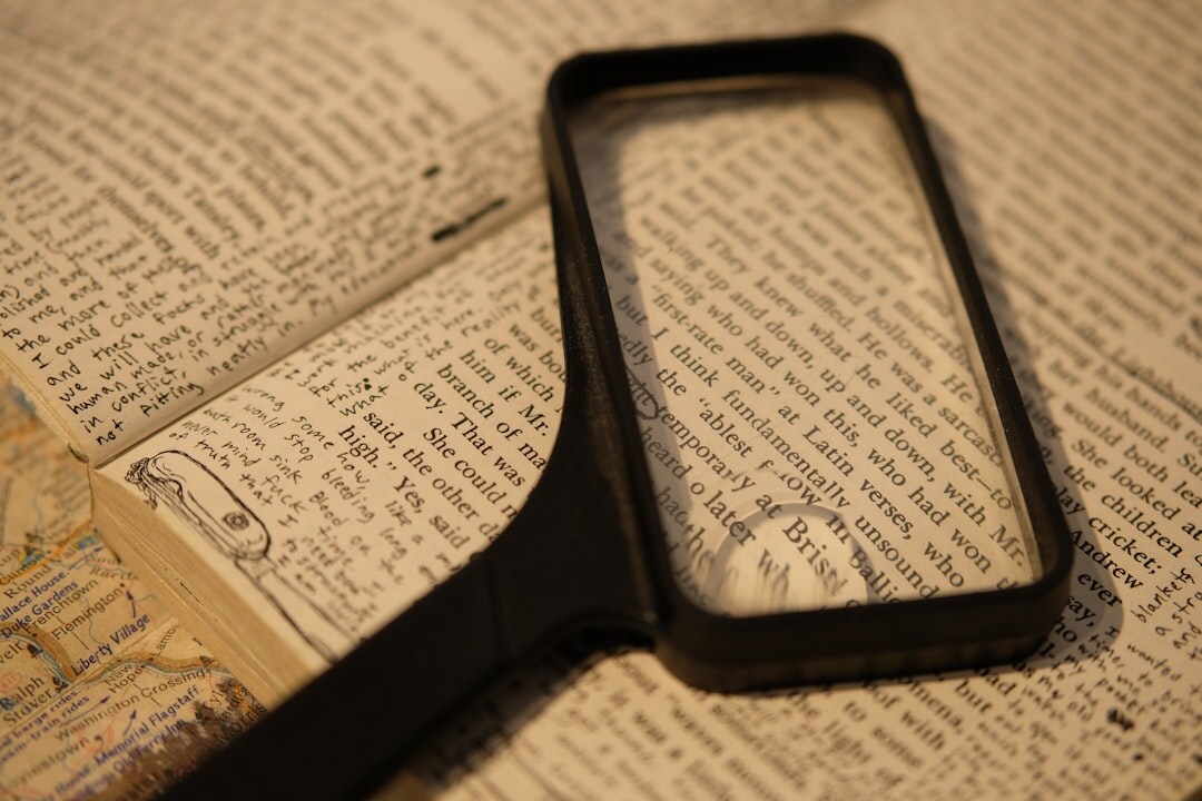open book with magnifying glass