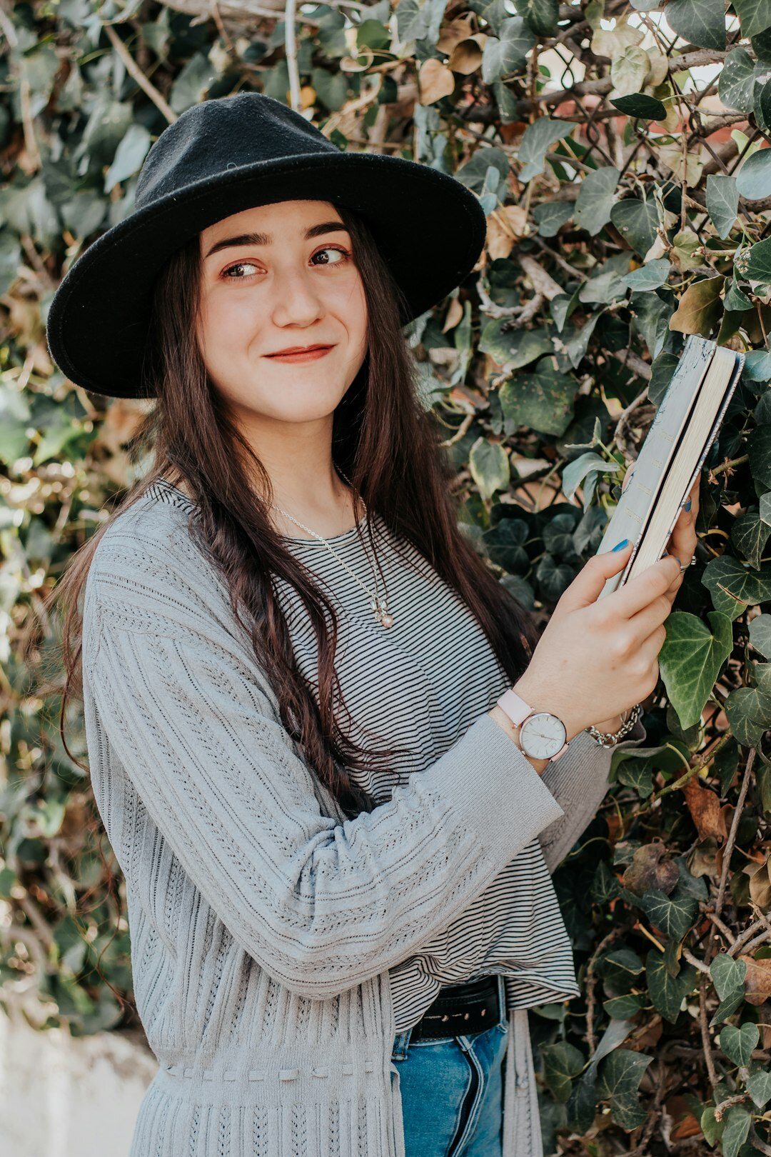 woman holding mystery book